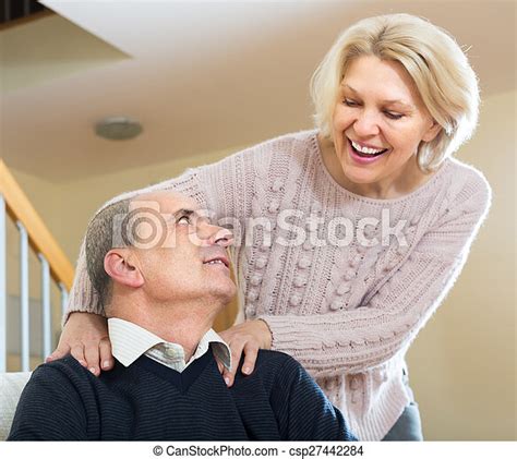 senior couple making a back massage mature woman