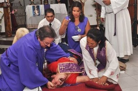 watch priests perform exorcism on screaming woman who was