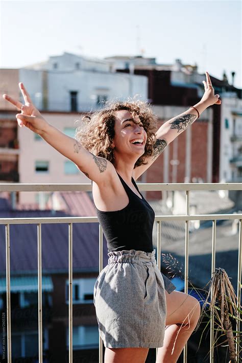 portrait of a woman on a rooftop in barcelona by stocksy contributor