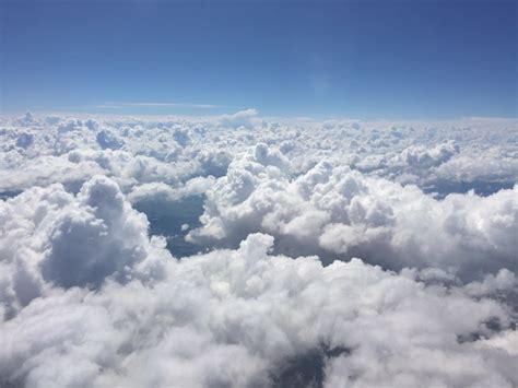 images horizon snow cloud sky view mountain range plane daytime flight cumulus