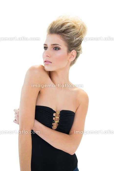 Stern Focused Blonde Model With Big Hairstyle Looking Away On White