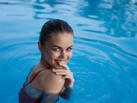 Premium Photo Cheerful Woman Swimming In The Pool Rest Clear Water