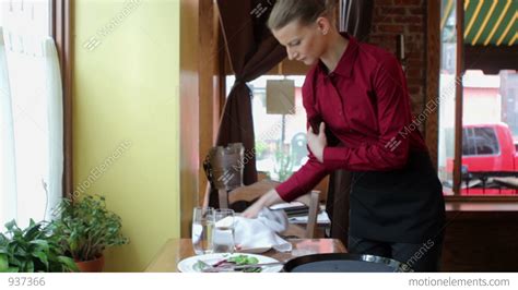 waitress clearing table in restaurant stock video footage