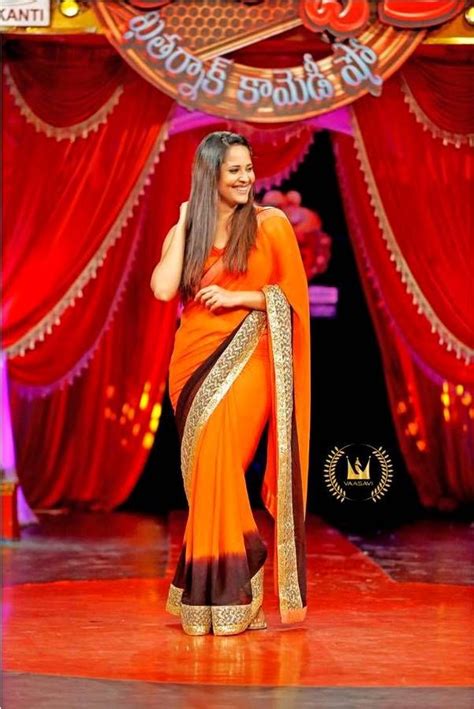 tv anchor anasuya hot hip back show in orange sari saree
