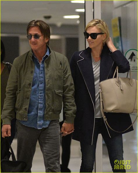 charlize theron and sean penn hold hands upon new york