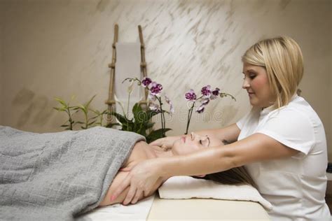 young woman relaxing  shoulder body massage  spa stock photo