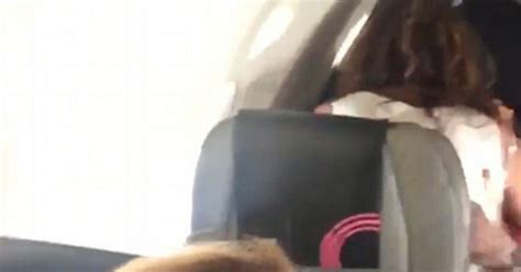 couple shamelessly have sex in their airplane seat as husband and wife film unexpected in flight