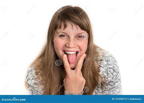 Woman Showing Tongue And Is Touching It With Two Fingers Stock Image