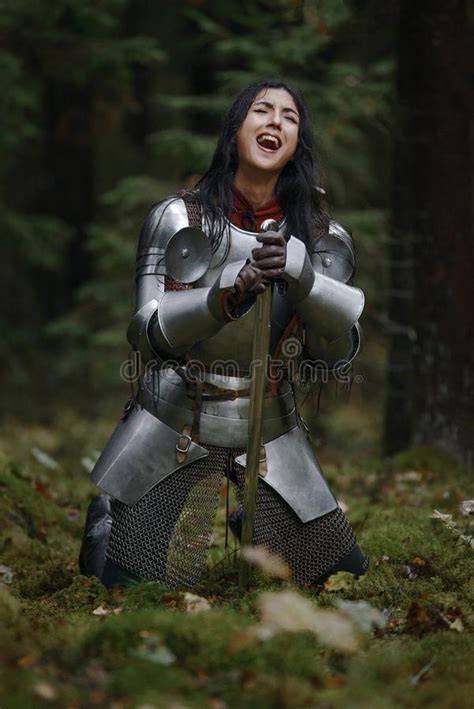 beautiful warrior girl   sword wearing chainmail  armor