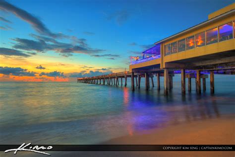 dania beach pier  beautiful morning glow  ocean royal stock photo