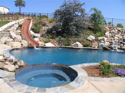 swimming pool    hill slopes boulders water  backyard swimming pool