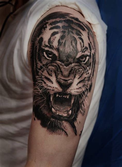 Realistic Tiger Tattoo On The Left Upper Arm And