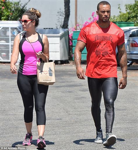 kelly brook goes make up free as she cycles to the gym with fiancé david mcintosh who turns