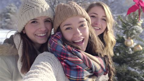 teens pose with their hot chocolate for cute christmas