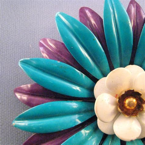 1960s blue and purple enameled metal flower power pin from