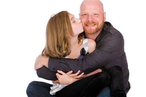 proud dad getting a cheek kiss from his daughter stock image image of