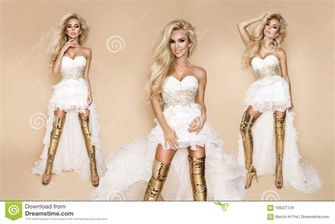 beautiful blonde bride model in a wedding dress and amazing gold shoes