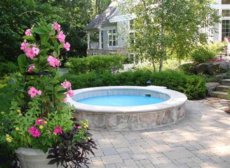 Hot Tub With A Beautiful Stone Surround By Peabody
