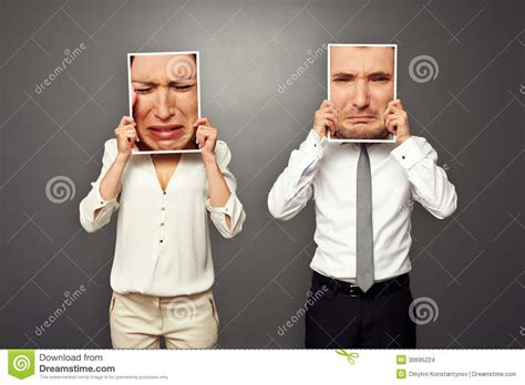 man and woman holding frames with sad faces stock images image 30695224