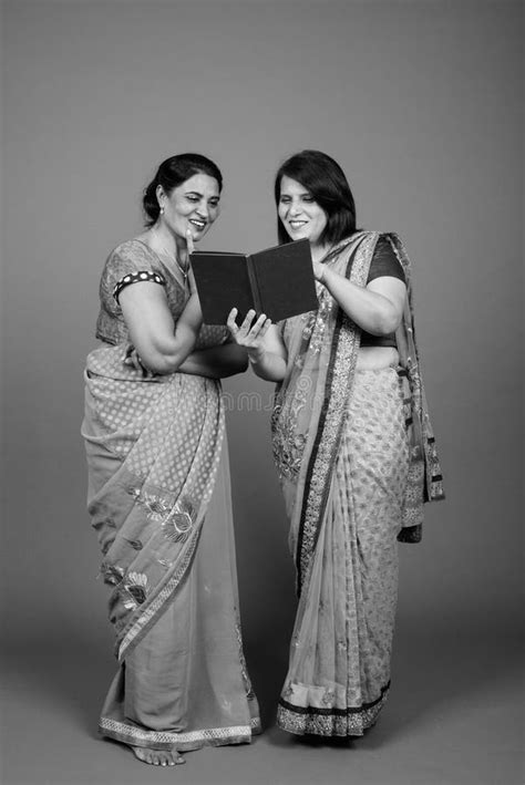 two mature indian women wearing sari indian traditional clothes