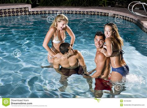 Two Couples In Swimming Pool At Night Stock Images Image