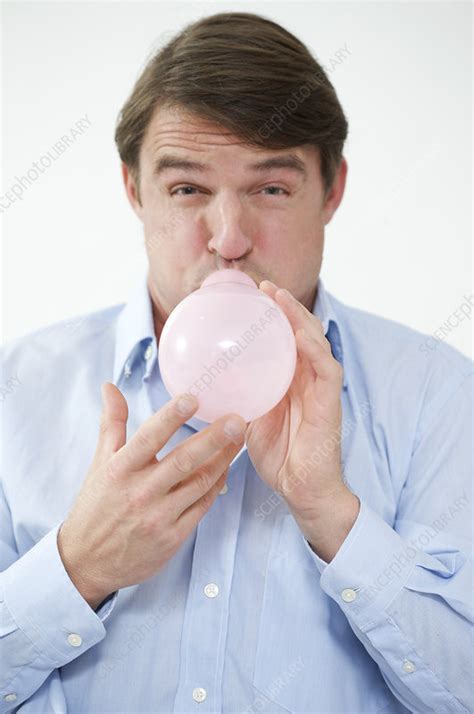 man   blow  balloon stock image  science photo