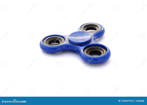 popular toy blue fidget spinner isolated  white background stock