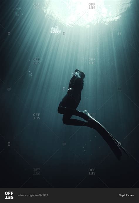 scuba diver swimming   surface stock photo offset