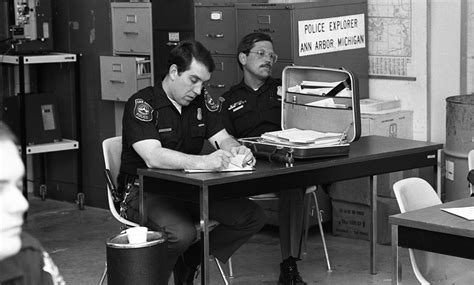 Ann Arbor Police Night Shift Officers Take Notes At Roll Call Meeting