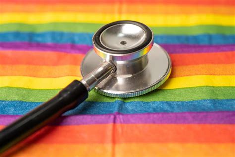 black stethoscope on rainbow flag background symbol of lgbt pride