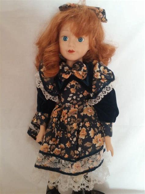 vintage porcelain doll 70s or 80s curly ginger hair satin ribbon and