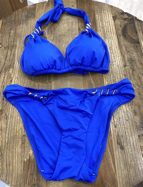 coleen rooney looks breathtaking in a vibrant blue bikini