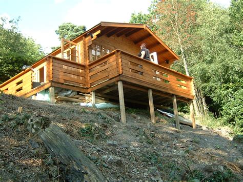 building  log cabin  sloping ground