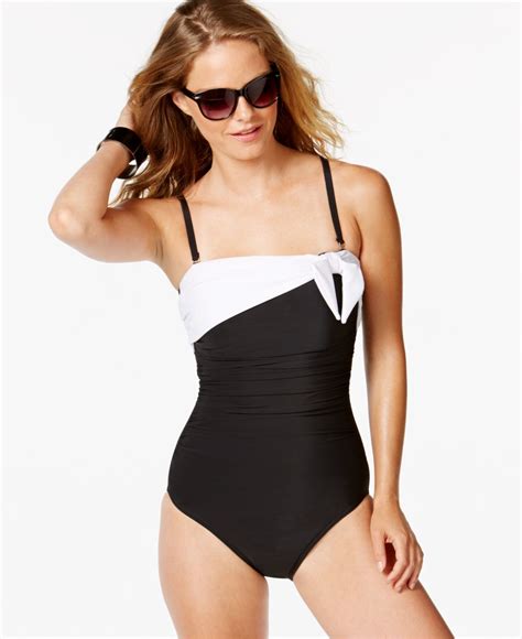 lyst miraclesuit asymmetrical sash ruched one piece swimsuit in black