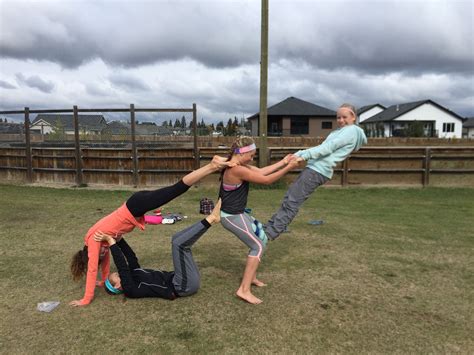 person acro stunt gymnastics stunts acro yoga group yoga poses