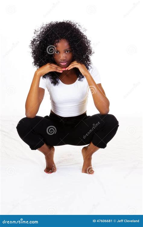 Attractive Skinny African American Teen Girl Squatting Stock Image