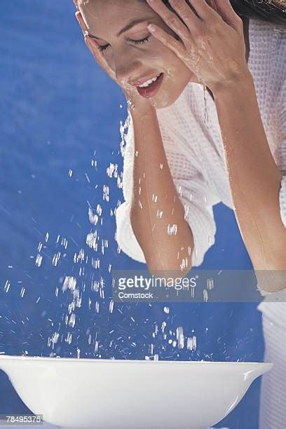 Woman Washing Face At Sink Photos And Premium High Res Pictures Getty