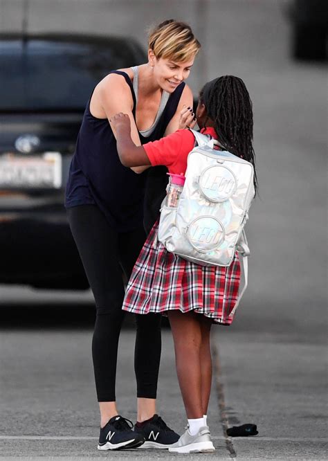 Charlize Theron Gives Daughter Jackson A Kiss On The Cheek Before Work