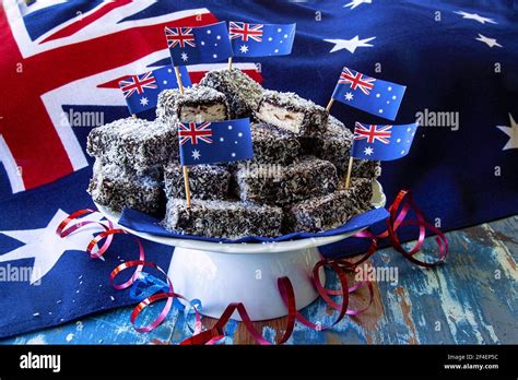 a plate of traditional chocolate and coconut lamington cakes for an