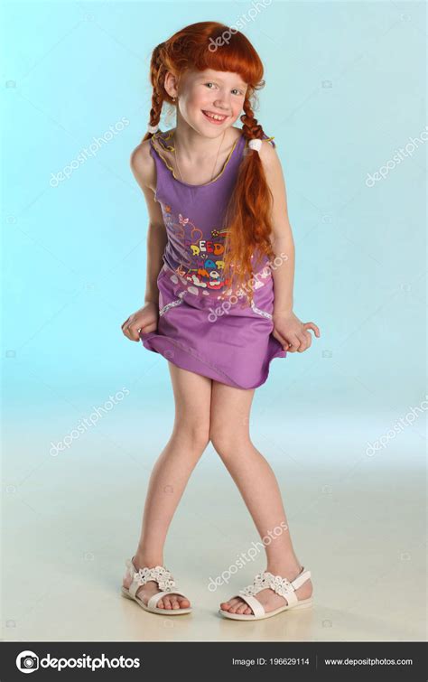 Beautiful Charming Little Redhead Girl Shows Her Summer