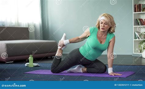 Tired Mature Woman Doing Yoga Exercises Stretching Legs Healthy