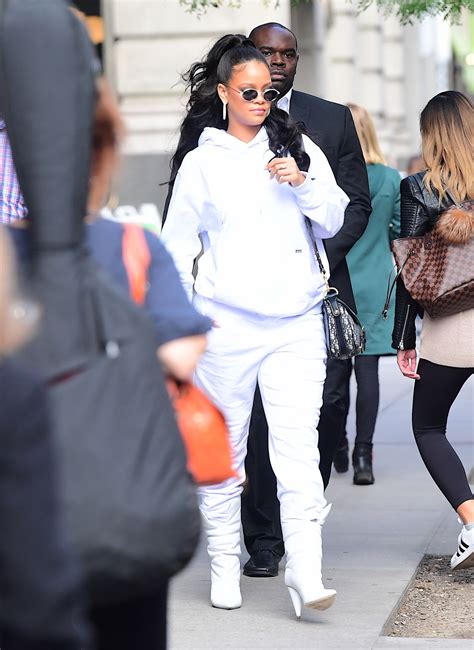 rihanna looks comfortable in an all white sweatsuit