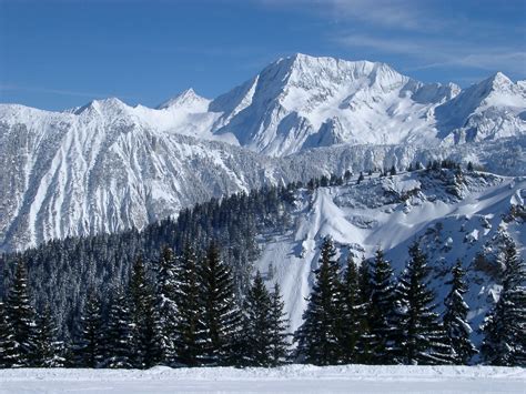 stock photo  steep alpine mountains covered  winter snow