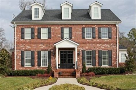 red brick colonial house exterior thinking  black door    future colonial house