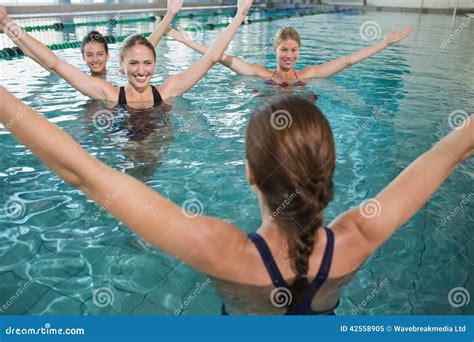 Smiling Female Fitness Class Doing Aqua Aerobics Stock Image Image Of