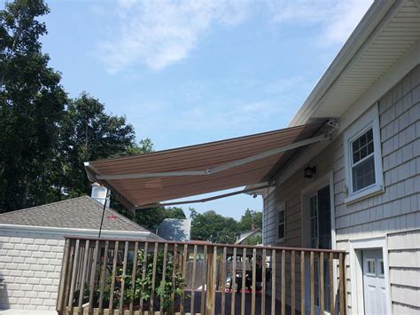 retractable awnings   time  spring american awning window