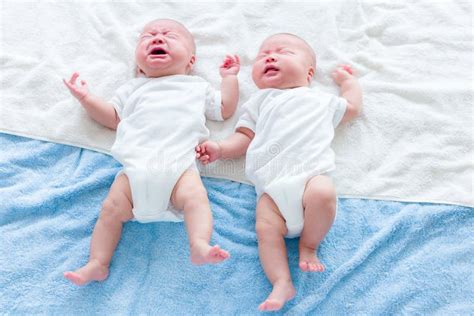 baby twins  crying   quiet stock photo image  child innocence