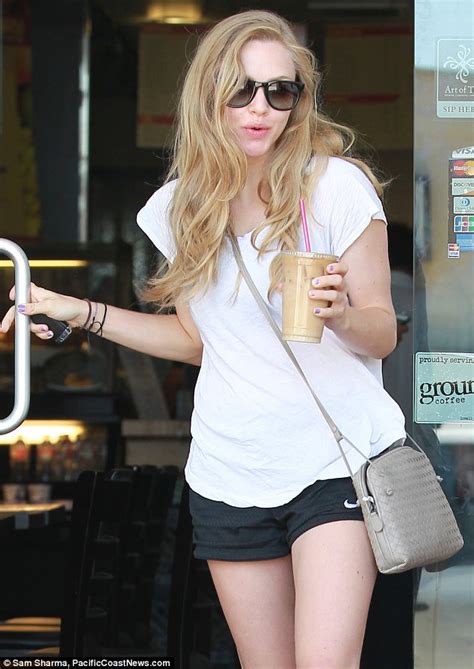 dressed down amanda seyfried jokes around with photographers as she grabs an iced coffee daily