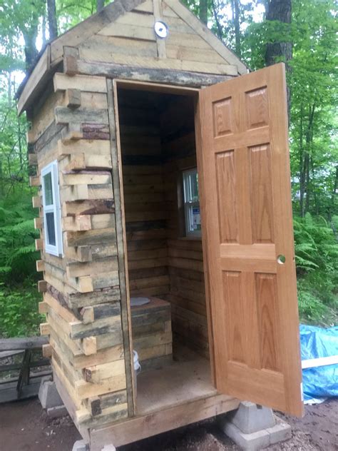 pallet outhouse turned  amazing