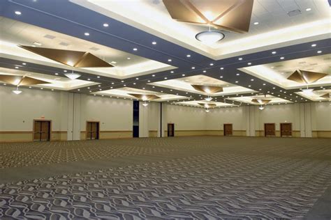 simple traditional grand ballroom featuring high ceilings customized lighting space